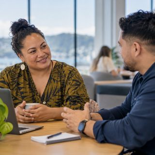 Two colleagues talking in an office